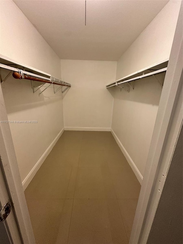 2165 SE Floresta Dr, Port St Lucie, FL 34984 - spacious closet with tile patterned flooring