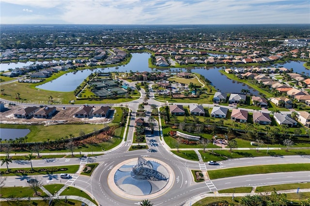 bird's eye view featuring a water view and a residential view