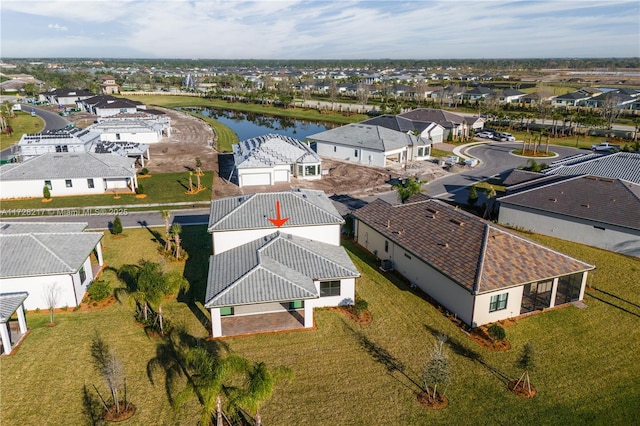 aerial view featuring a residential view and a water view