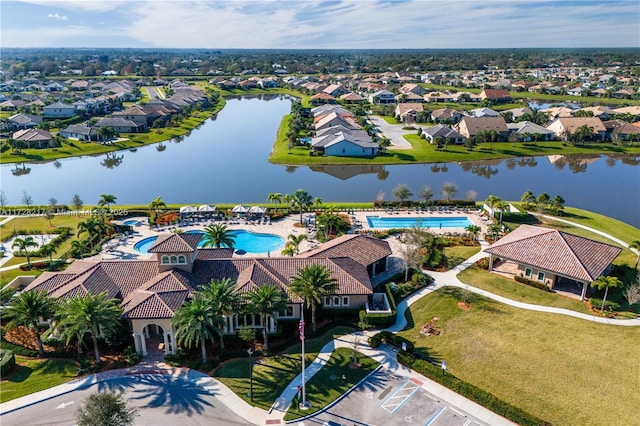 aerial view with a water view and a residential view