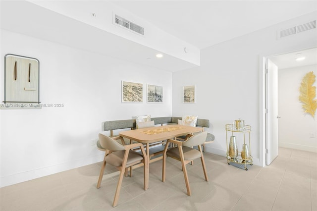 tiled dining room with breakfast area