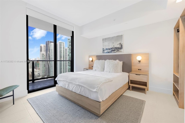 bedroom featuring access to outside and expansive windows