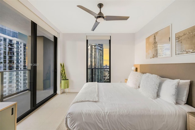 bedroom featuring ceiling fan, access to exterior, and floor to ceiling windows