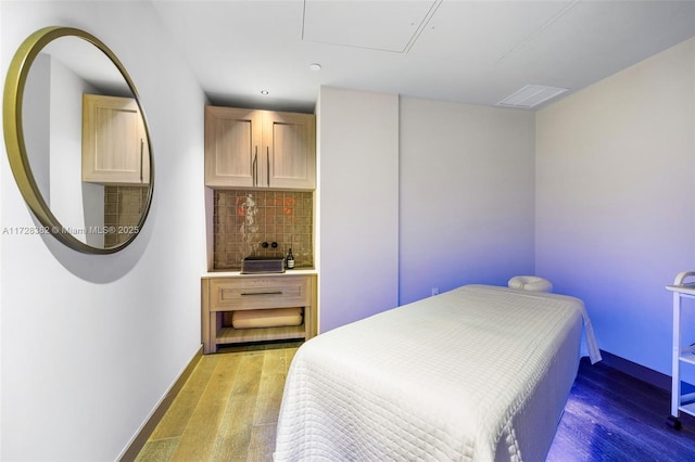 bedroom featuring hardwood / wood-style flooring