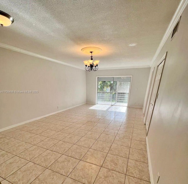 tiled spare room featuring a textured ceiling, a chandelier, and crown molding