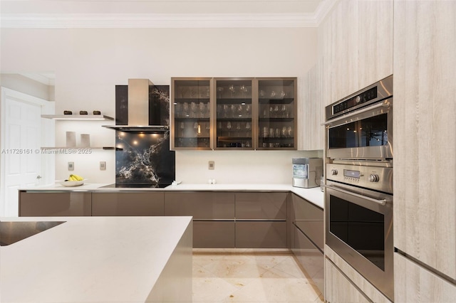 kitchen featuring light tile patterned floors, black electric stovetop, crown molding, wall chimney exhaust hood, and double oven