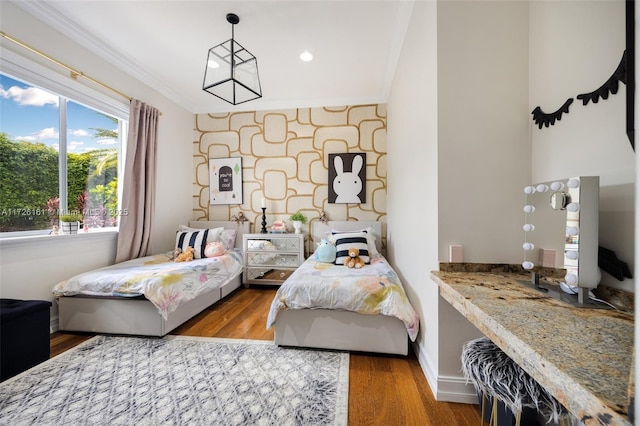 bedroom with dark hardwood / wood-style flooring and ornamental molding