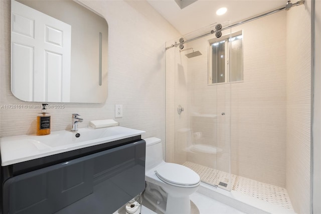 bathroom with a shower with door, toilet, vanity, and tasteful backsplash