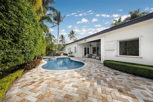 view of pool with a patio area, an outdoor hangout area, and ceiling fan