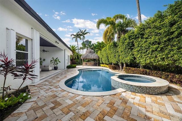 view of pool with a gazebo, a patio, and an in ground hot tub