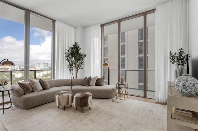 living room with hardwood / wood-style flooring and floor to ceiling windows