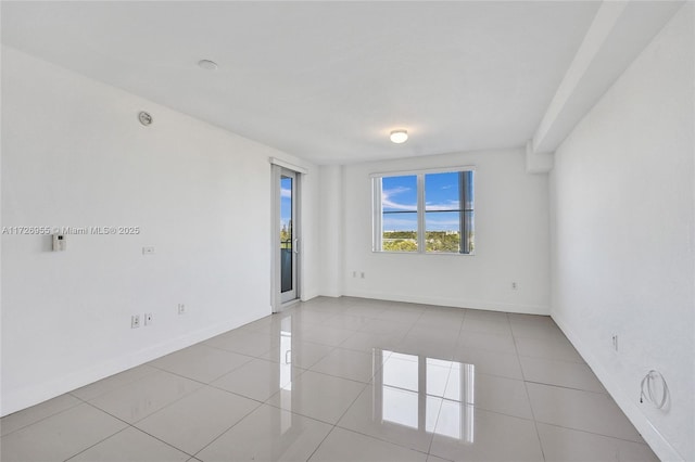 view of tiled spare room