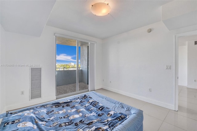 tiled bedroom with access to outside