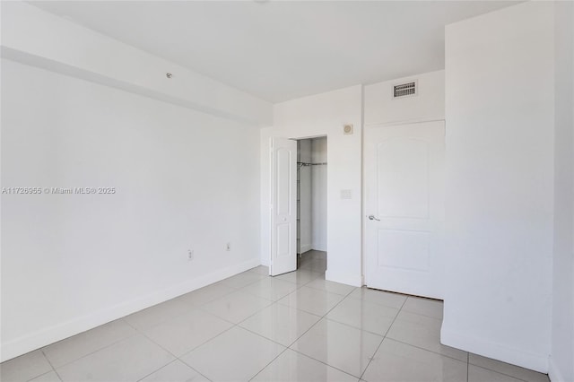 unfurnished bedroom featuring light tile patterned floors