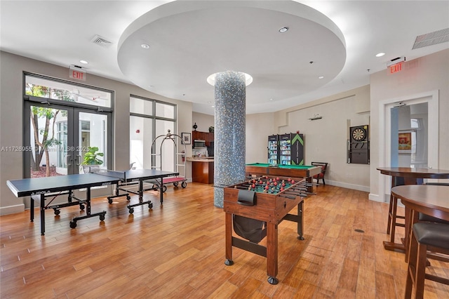 game room featuring light hardwood / wood-style flooring, french doors, and billiards