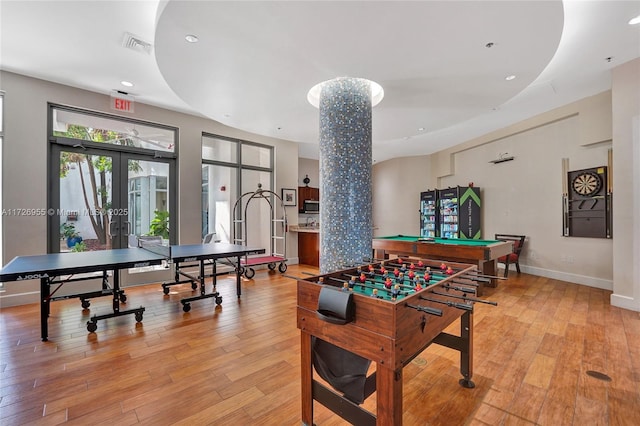 rec room featuring billiards, french doors, and light hardwood / wood-style floors