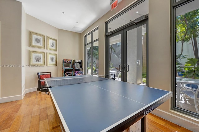 game room featuring light hardwood / wood-style floors and french doors