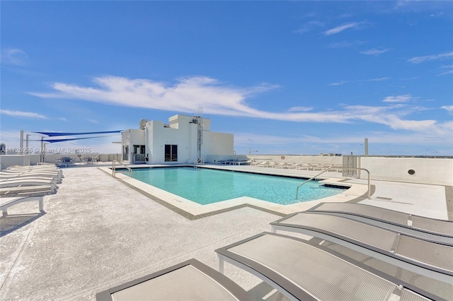 view of pool featuring a patio area