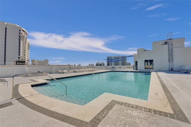 view of swimming pool featuring a patio