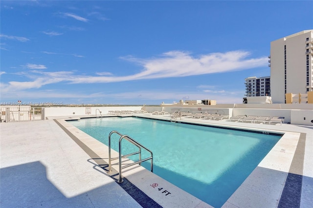 view of swimming pool featuring a patio