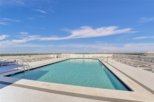 view of swimming pool with a patio area