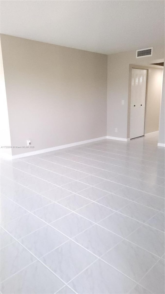 empty room featuring tile patterned flooring