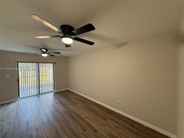 spare room with dark hardwood / wood-style flooring