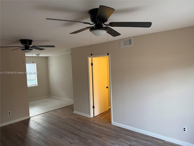 unfurnished room featuring hardwood / wood-style floors