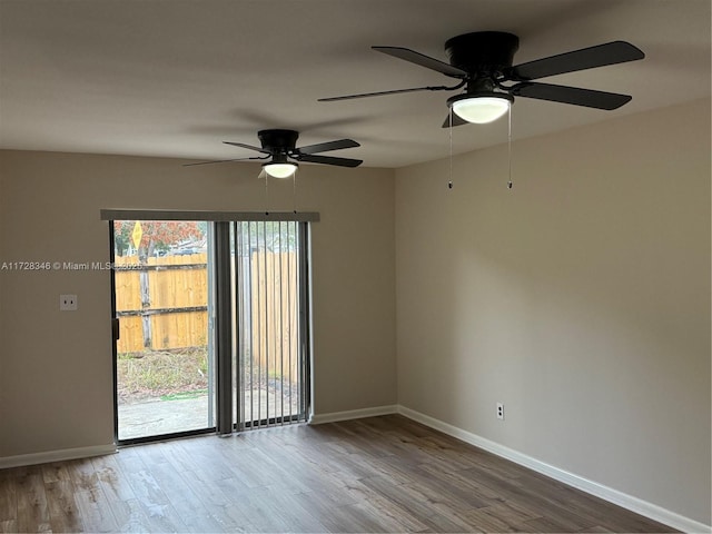 empty room with hardwood / wood-style floors