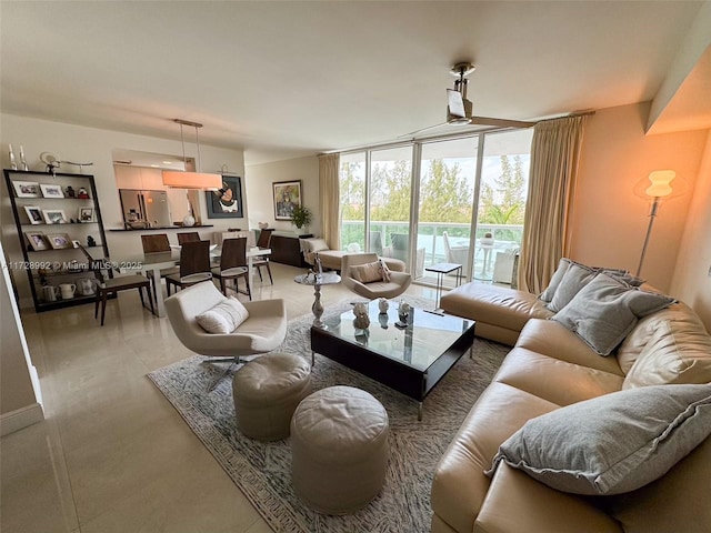 living room featuring a wall of windows