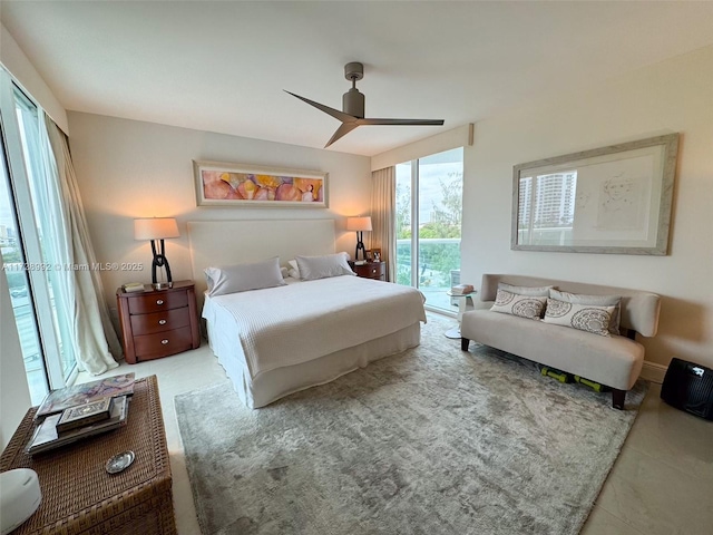 bedroom with ceiling fan, multiple windows, light tile patterned floors, and access to outside