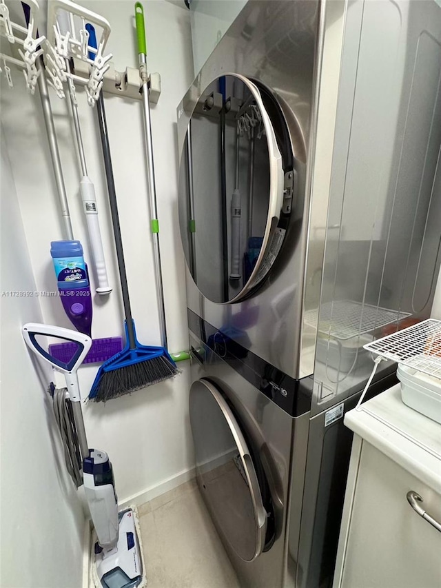 laundry area with stacked washer and clothes dryer