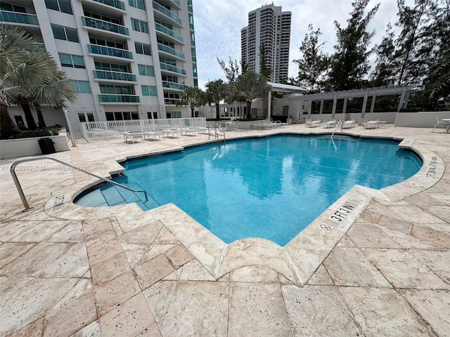 view of pool featuring a patio area