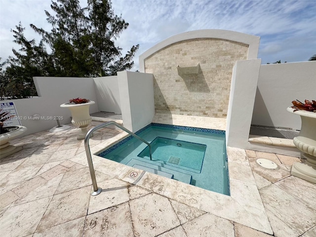 view of pool with a community hot tub