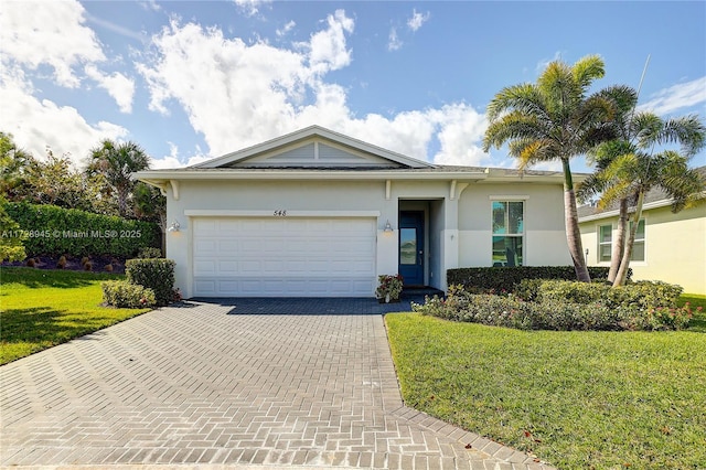 single story home with a front lawn and a garage