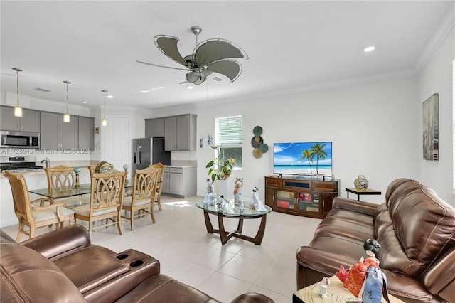 tiled living room with ceiling fan and crown molding