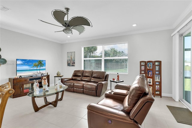 living room featuring ceiling fan, plenty of natural light, and crown molding