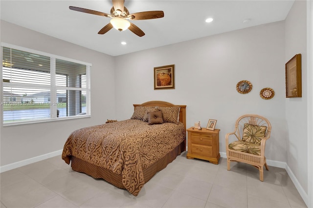 tiled bedroom featuring ceiling fan