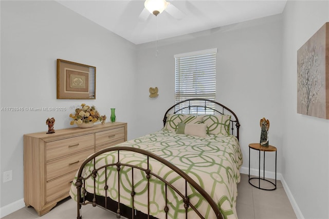 tiled bedroom with ceiling fan