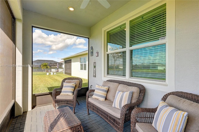 sunroom / solarium with ceiling fan