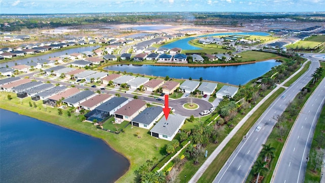 drone / aerial view featuring a water view