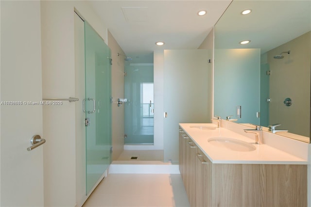 bathroom with vanity and an enclosed shower