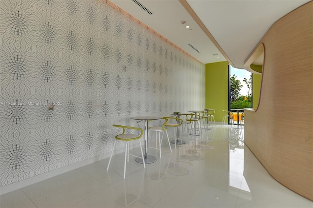 unfurnished dining area with light tile patterned floors