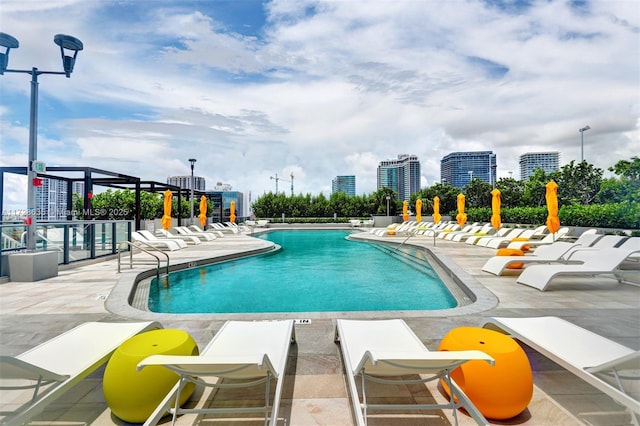 view of swimming pool with a patio area