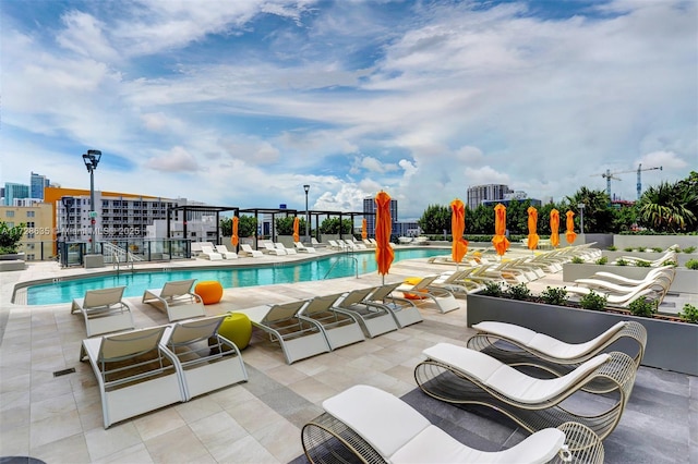 view of swimming pool with a patio