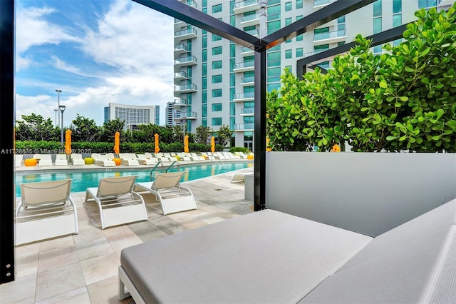 view of pool featuring a patio