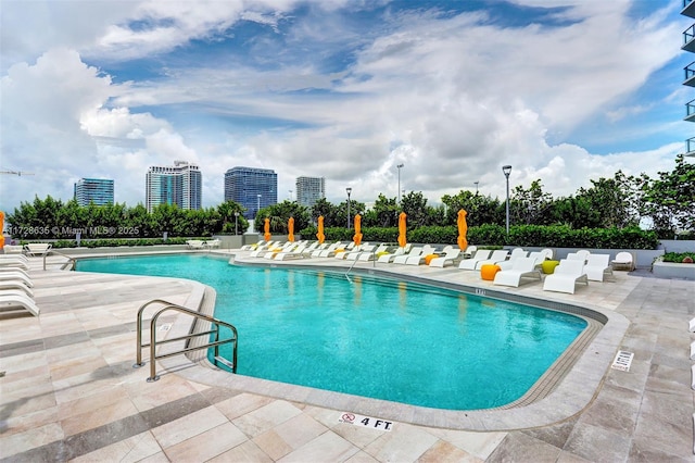 view of swimming pool with a patio area