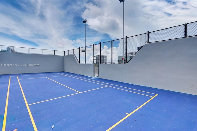 view of sport court featuring basketball hoop