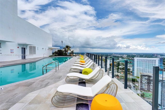 view of pool featuring a patio area