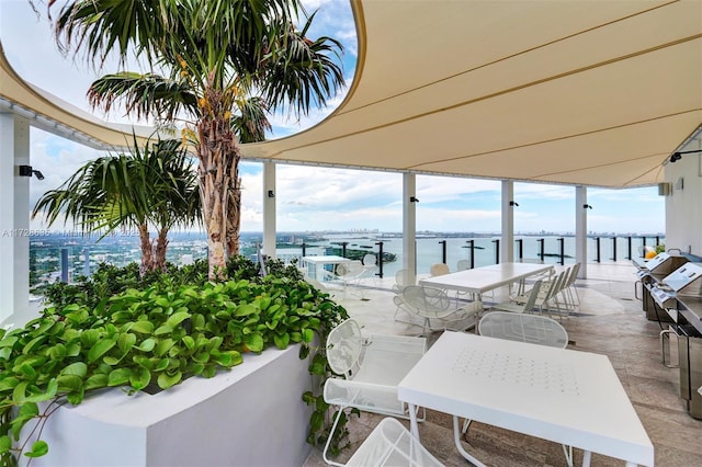 view of patio with a water view